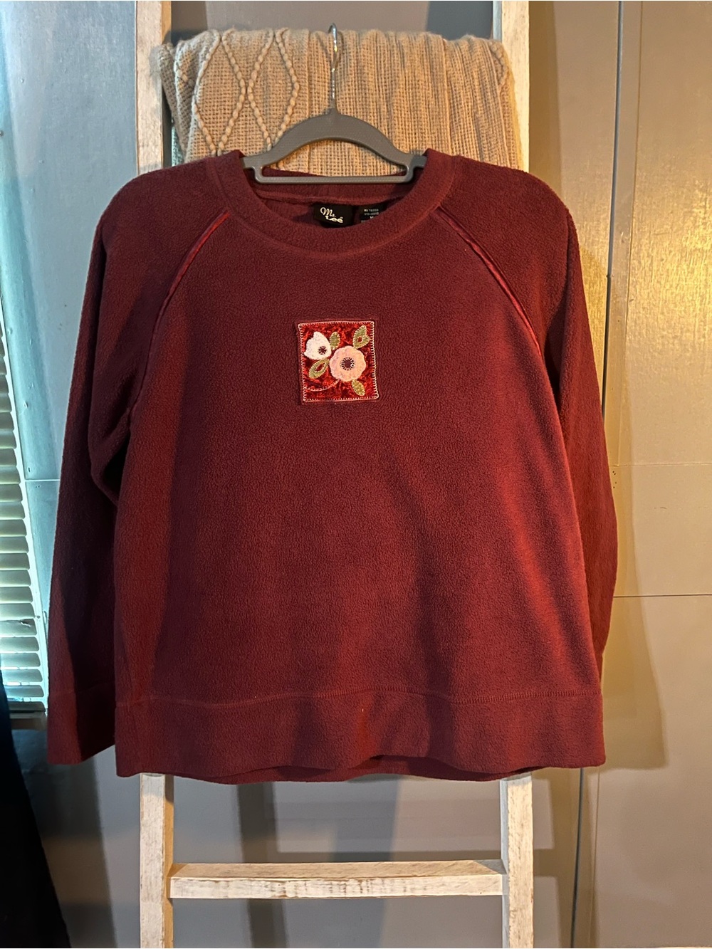 Cozy Women's Maroon Crewneck Sweater with Floral Emblem